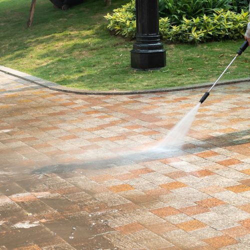 Outdoor floor cleaning with a pressure water jet on street Outdoor floor cleaning with a pressure water jet on street